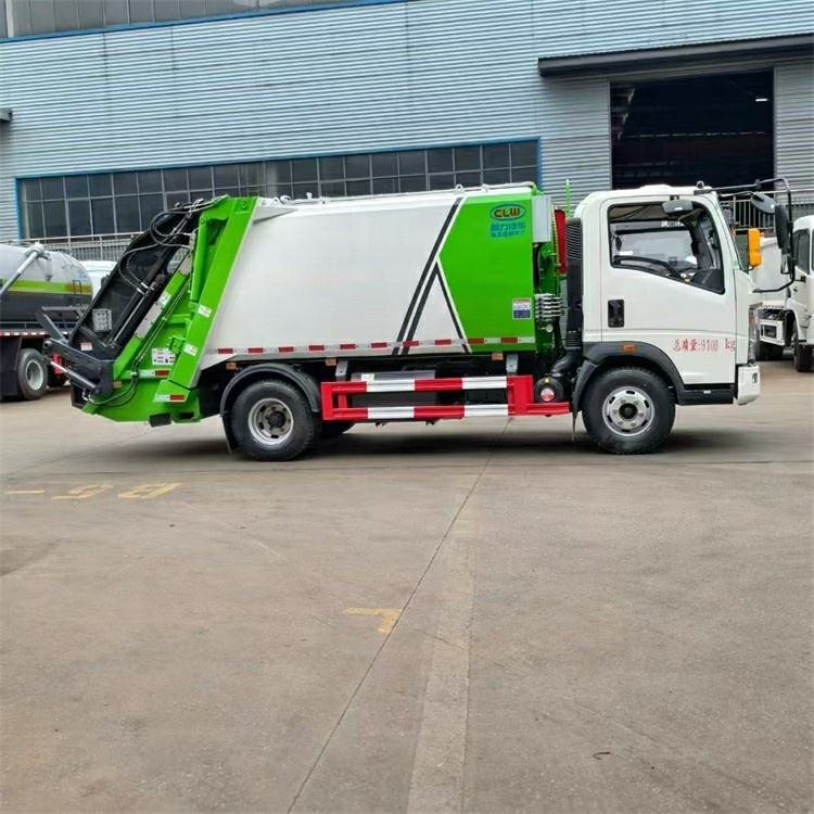 HOWO 5CBM 4X2 Manual Transmission Garbage Compactor Truck with Motor for Urban Sanitation and Refuse Collection